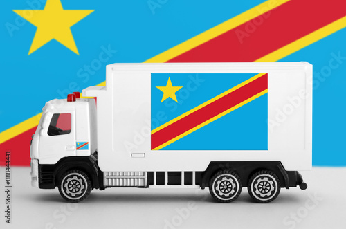 Democratic Republic of the Congo flag depicted on side wall of white delivery van close up. Shipping and local delivery concept photo