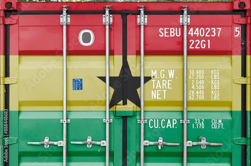 Ghana flag depicted on metal doors of shipping cargo container outdoors in docks area close up photo