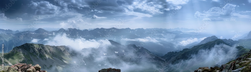 Naklejka premium Misty Mountain Peaks in the Light of Day