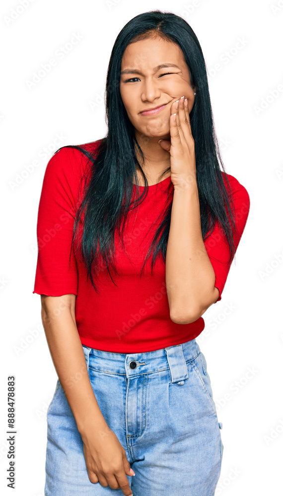 Beautiful hispanic woman wearing casual clothes touching mouth with hand with painful expression because of toothache or dental illness on teeth. dentist Beautiful hispanic woman wearing casual clothes touching mouth with hand with painful expression because of toothache or dental illness on teeth. dentist