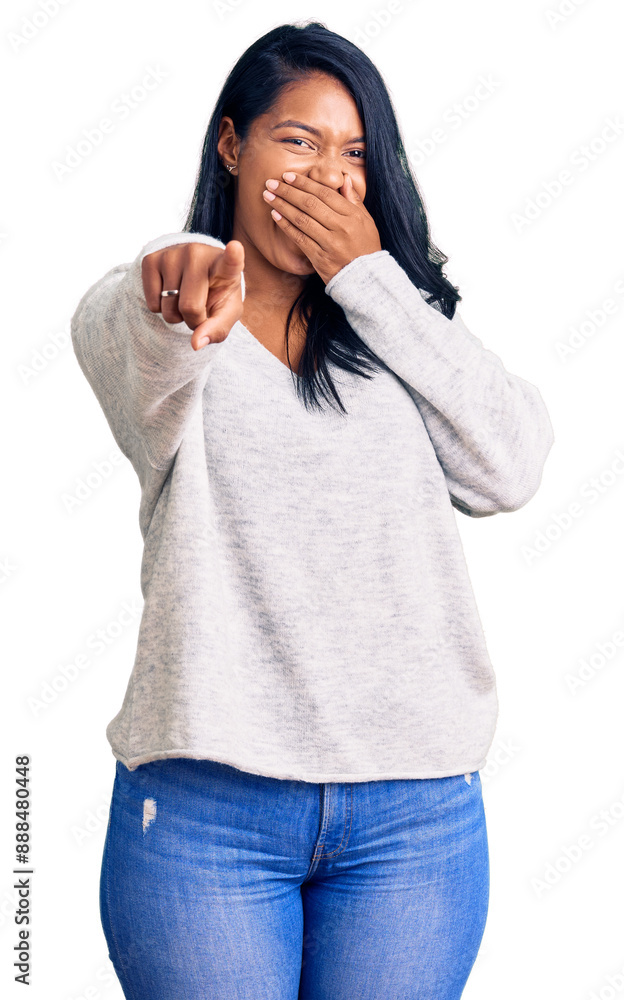 Hispanic woman with long hair wearing casual clothes laughing at you, pointing finger to the camera with hand over mouth, shame expression Hispanic woman with long hair wearing casual clothes laughing at you, pointing finger to the camera with hand over mouth, shame expression