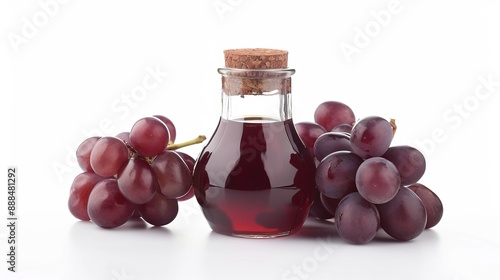 Glass jar filled with red grape vinegar isolated on a white background