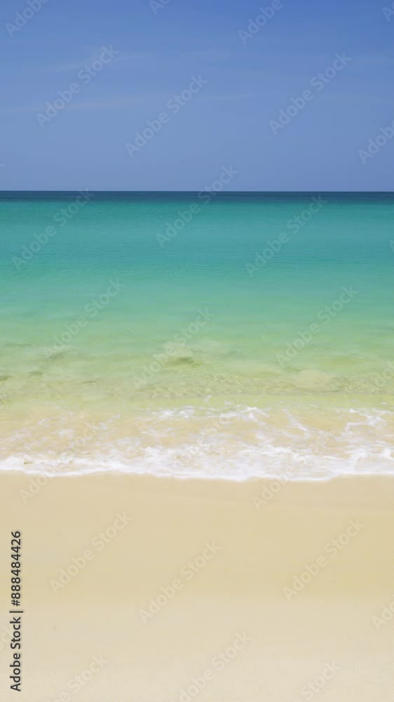 Pristine golden sands Surin Beach with tranquil turquoise waters in Phuket, Thailand - Vertical Pristine golden sands Surin Beach with tranquil turquoise waters in Phuket, Thailand - Vertical
