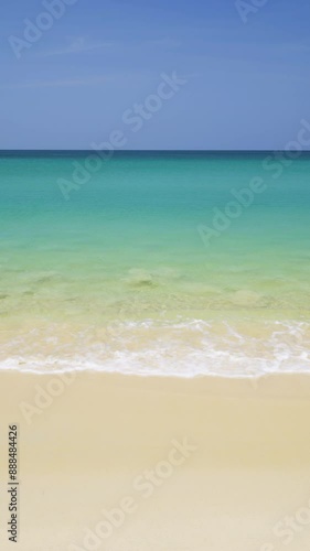 Pristine golden sands Surin Beach with tranquil turquoise waters in Phuket, Thailand - Vertical