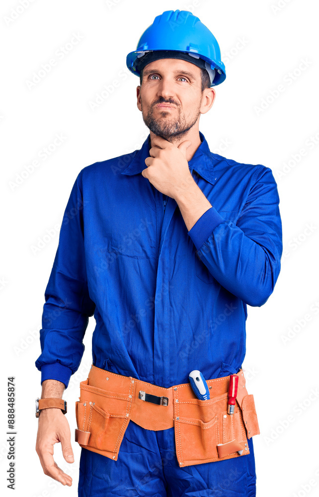 Young handsome man wearing worker uniform and hardhat making fun of people with fingers on forehead doing loser gesture mocking and insulting. Young handsome man wearing worker uniform and hardhat making fun of people with fingers on forehead doing loser gesture mocking and insulting.