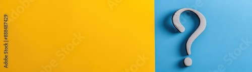 Abstract concept image with a question mark on a blue background next to a yellow background. Ideal for problem-solving or inquiry themes.