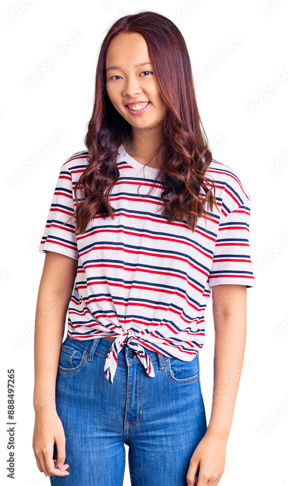 Young beautiful chinese girl wearing casual clothes looking positive and happy standing and smiling with a confident smile showing teeth Young beautiful chinese girl wearing casual clothes looking positive and happy standing and smiling with a confident smile showing teeth