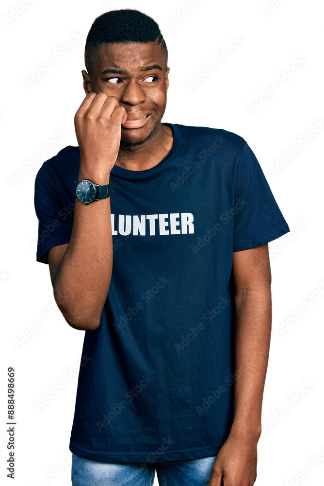 Fototapeta premium Young african american man wearing volunteer t shirt looking stressed and nervous with hands on mouth biting nails. anxiety problem.