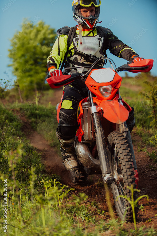 Professional enduro bike rider dirt ride on the muddy road. Motocross sport. Professional enduro bike rider dirt ride on the muddy road. Motocross sport.