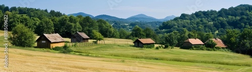 Scenic countryside landscape with traditional wooden cottages, lush green fields, and forested hills under a clear blue sky. © AbsoluteAI