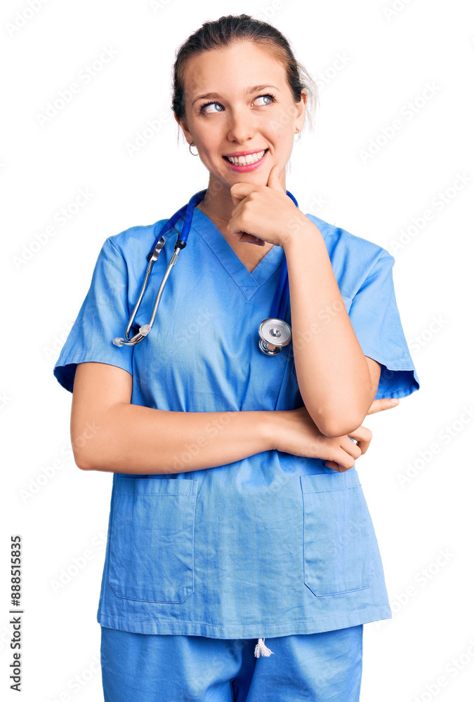 Young beautiful blonde woman wearing doctor uniform and stethoscope with hand on chin thinking about question, pensive expression. smiling with thoughtful face. doubt concept. Young beautiful blonde woman wearing doctor uniform and stethoscope with hand on chin thinking about question, pensive expression. smiling with thoughtful face. doubt concept.