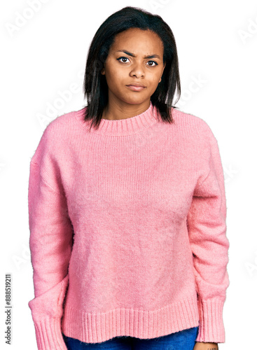 Beautiful hispanic woman wearing casual winter sweater skeptic and nervous, frowning upset because of problem. negative person.