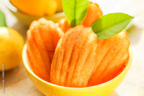 Madeleine cookies.Madeleine biscuit cookies. sweet French dessert . Lemon French cookies and lemons fruits .French madeleine cookies  photo