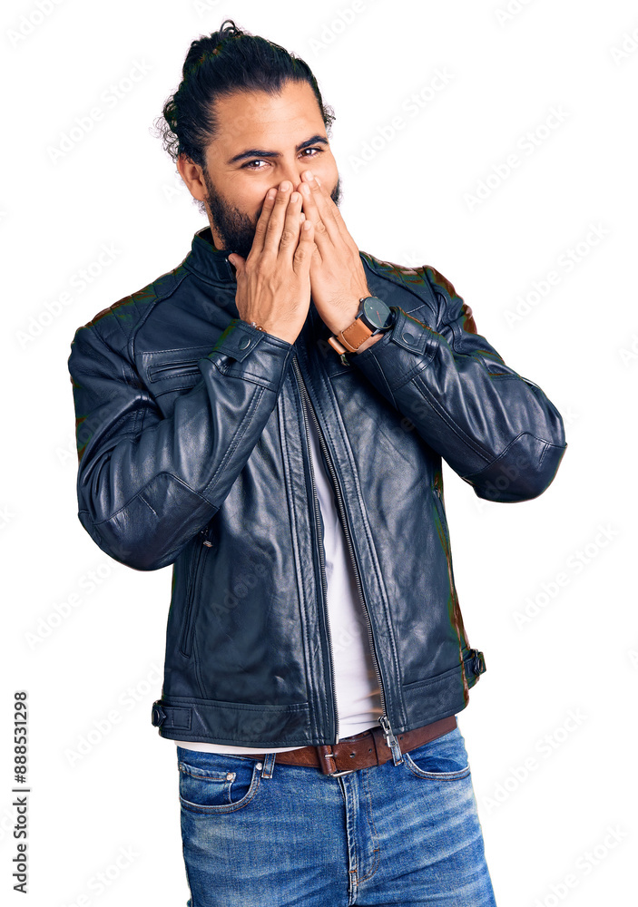 Young arab man wearing casual leather jacket laughing and embarrassed giggle covering mouth with hands, gossip and scandal concept Young arab man wearing casual leather jacket laughing and embarrassed giggle covering mouth with hands, gossip and scandal concept