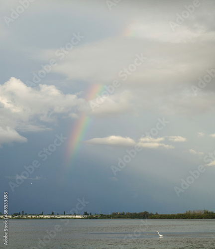 Obraz na plátně Rainbow arching over the water on the Gulf of Mexico
