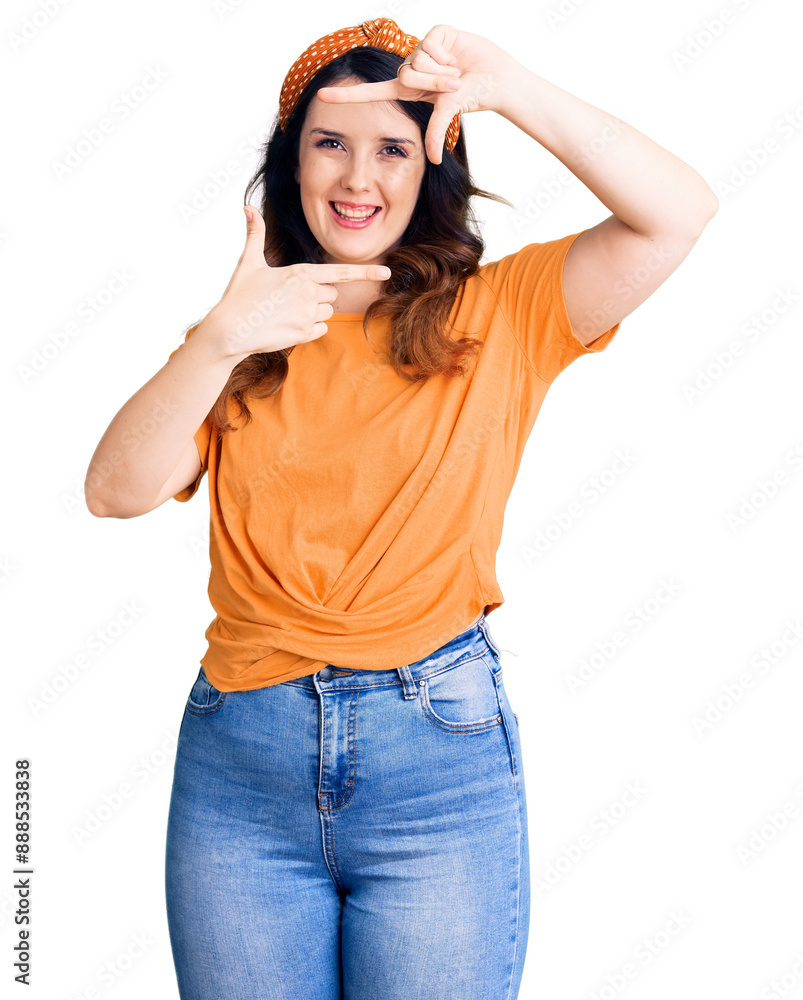 Beautiful young brunette woman wearing casual clothes smiling making frame with hands and fingers with happy face. creativity and photography concept. Beautiful young brunette woman wearing casual clothes smiling making frame with hands and fingers with happy face. creativity and photography concept.