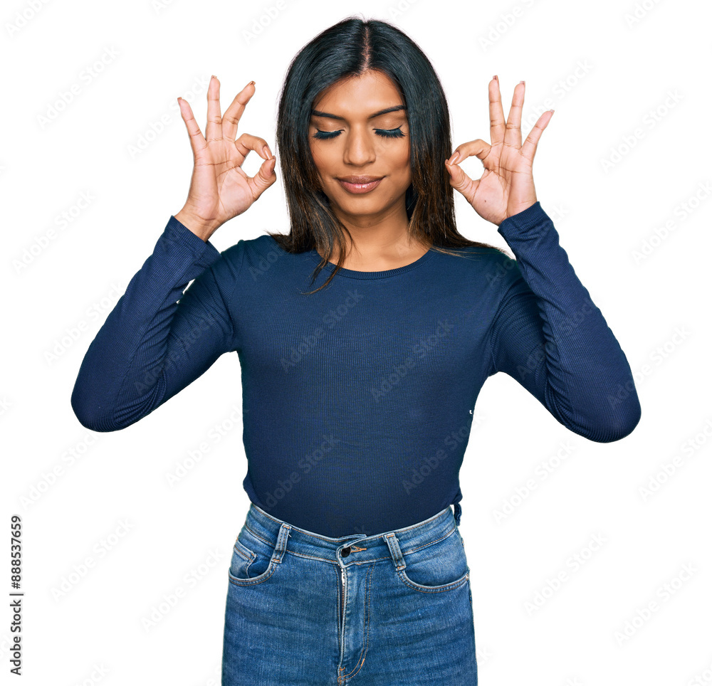 Young latin transsexual transgender woman wearing casual clothes relax and smiling with eyes closed doing meditation gesture with fingers. yoga concept. Young latin transsexual transgender woman wearing casual clothes relax and smiling with eyes closed doing meditation gesture with fingers. yoga concept.