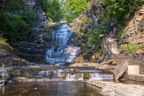 Beautiful cascading waterfall surrounded by lush greenery. Cascadilla Gorge in Ithaca New York- Finger Lakes Region
 photo