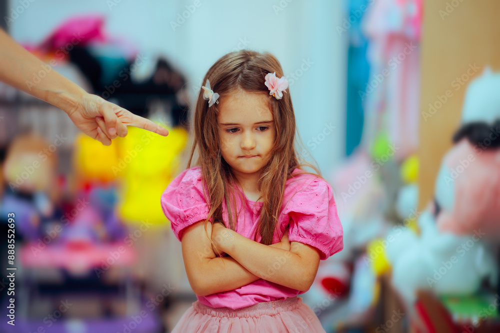 Little Girl Being Scolded in a Toy Store by her Parent. Frustrated child making a mistake being punished about it
Little Girl Being Scolded in a Toy Store by her Parent. Frustrated child making a mistake being punished about it