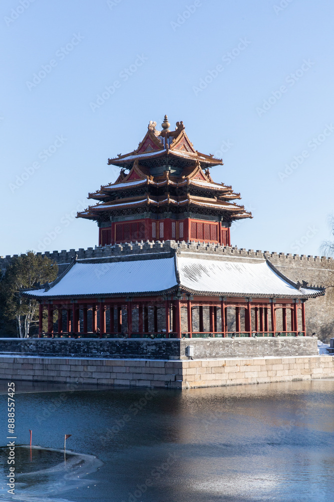Fototapeta premium winter sonw view of the corner tower and moat of the Forbidden city