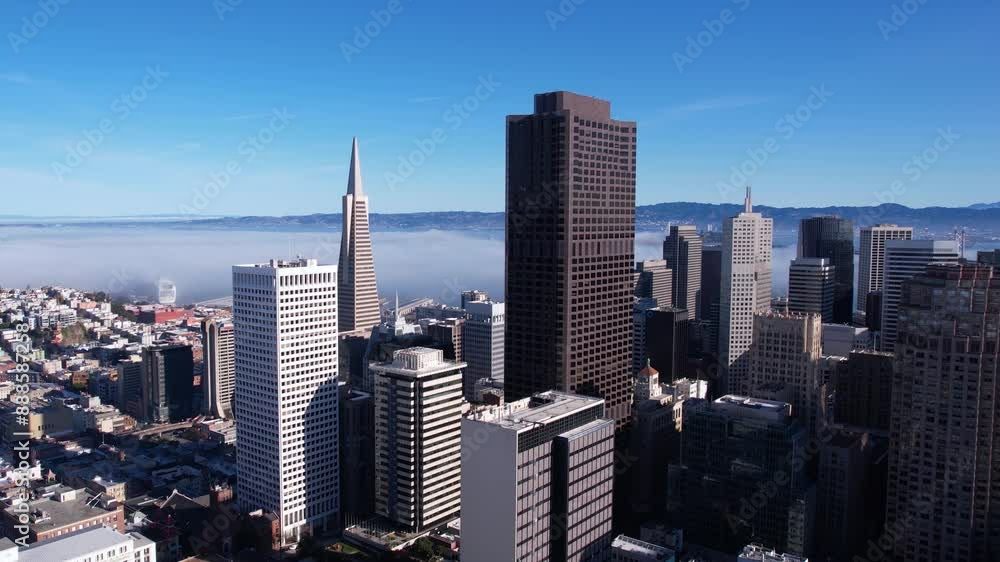 Drone Shot of Downtown San Francisco Cityscape Skyline. Skyscrapers and Towers on Sunny Day With Mist Above Bay
