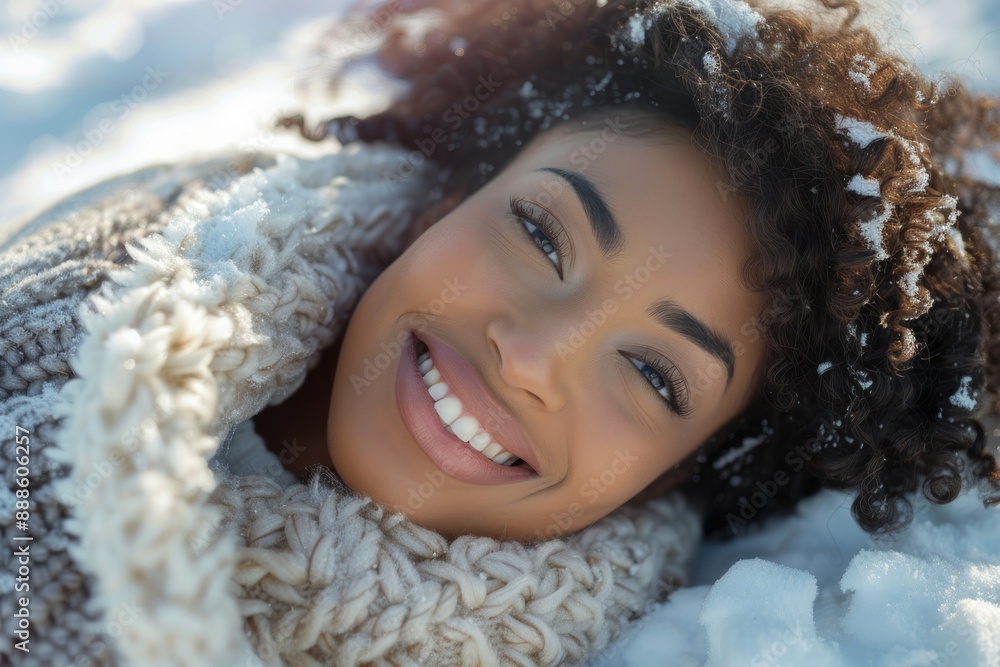 winter mood. Beautiful young smiling black woman lying on the winter snow winter mood. Beautiful young smiling black woman lying on the winter snow