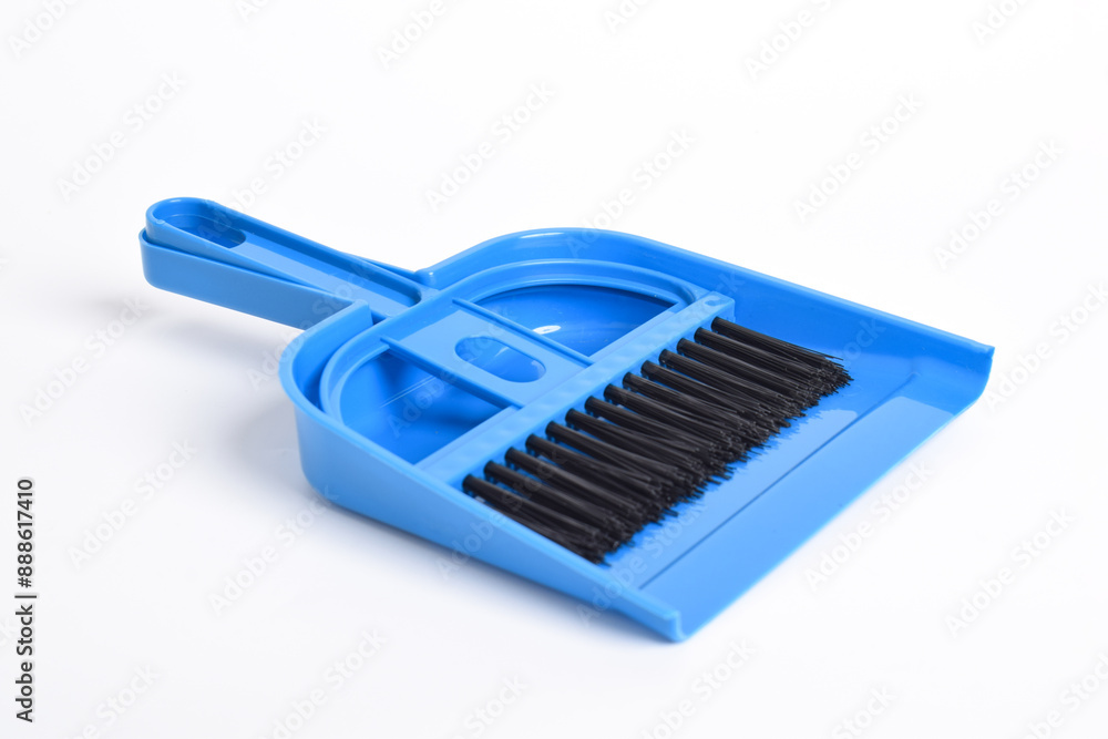 Small blue broom and dustpan set isolated on white background Small blue broom and dustpan set isolated on white background