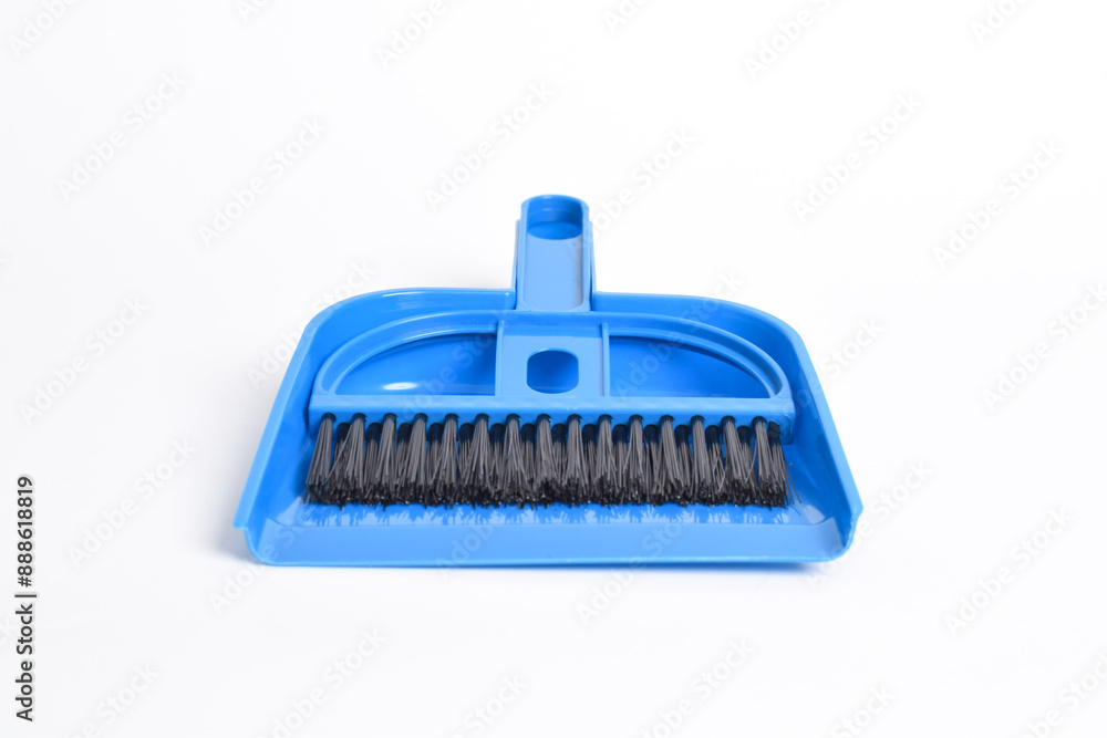 Small blue broom and dustpan set isolated on white background Small blue broom and dustpan set isolated on white background
