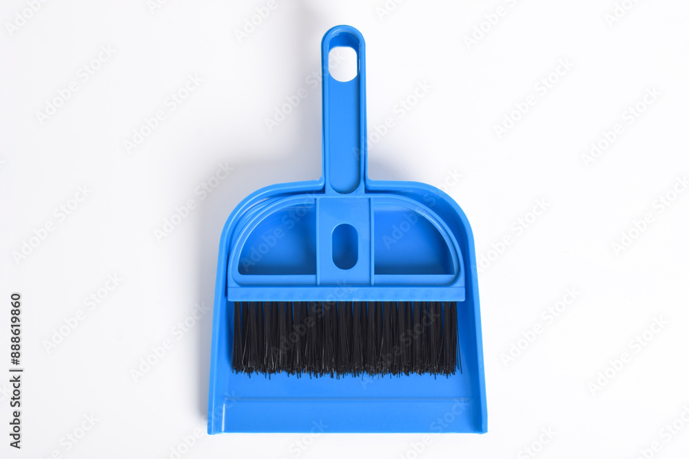 Small blue broom and dustpan set isolated on white background Small blue broom and dustpan set isolated on white background