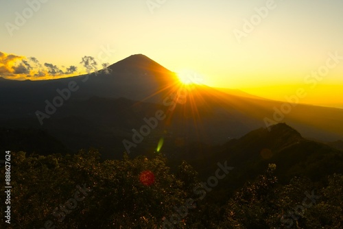 Scenic view of Mount Agung (the highest point on Bali, 3031 m) taken at sunset from the Lahangan Sweet viewpoint located in east Bali (Kecamatan Abang Subdistrict, Karangasem Regency, Bali, Indonesia) photo