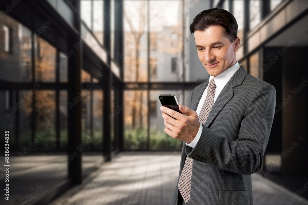 Happy confident business man standing in office Happy confident business man standing in office