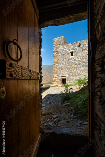 Obraz na płótnie Al Bahah, Saudi Arabia: A view through an old wooden door of the Thee Ain, or Zee Ain ancient village in Saudi Arabia near Jeddah. w salonie