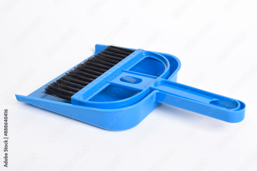 Small blue broom and dustpan set isolated on white background Small blue broom and dustpan set isolated on white background