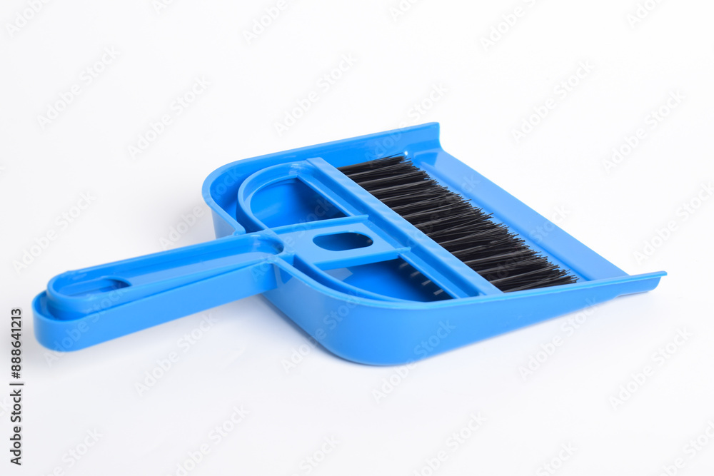 Small blue broom and dustpan set isolated on white background Small blue broom and dustpan set isolated on white background