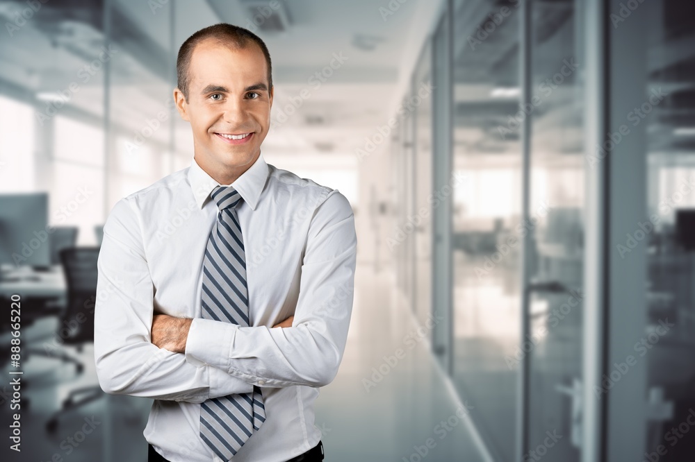 Happy business man looking at camera posing Happy business man looking at camera posing