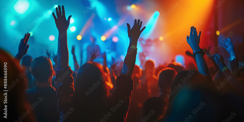 Crowd cheering with arms raised at music festival Crowd cheering with arms raised at music festival