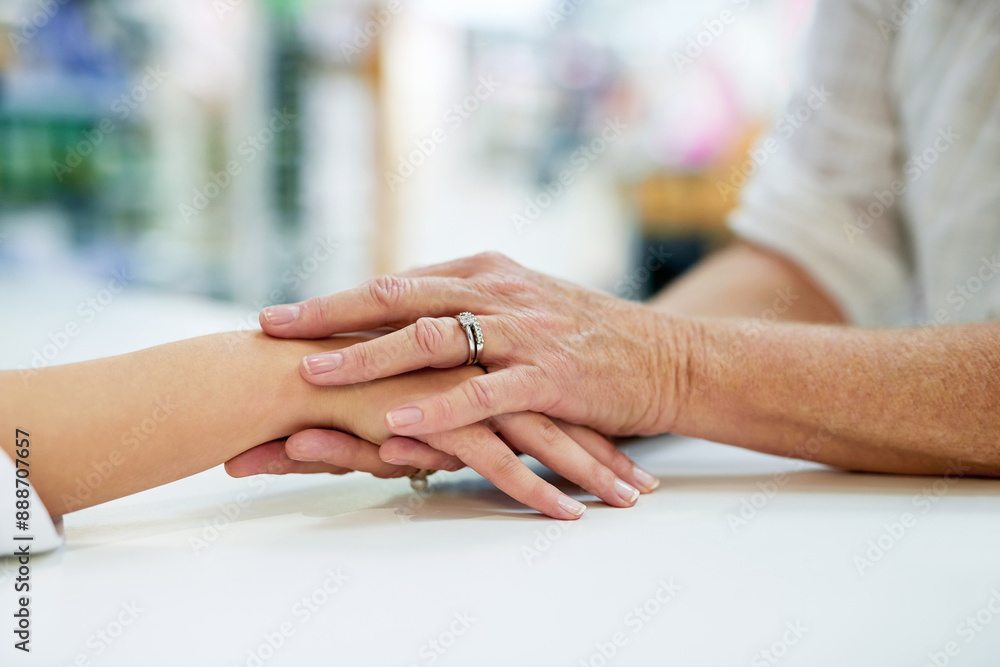 Obraz premium Pharmacist, woman and holding hands with support for healthcare with empathy, kindness and helping. Pharmacy, customer and person with sympathy, assistance and comfort in pharmaceutical dispensary