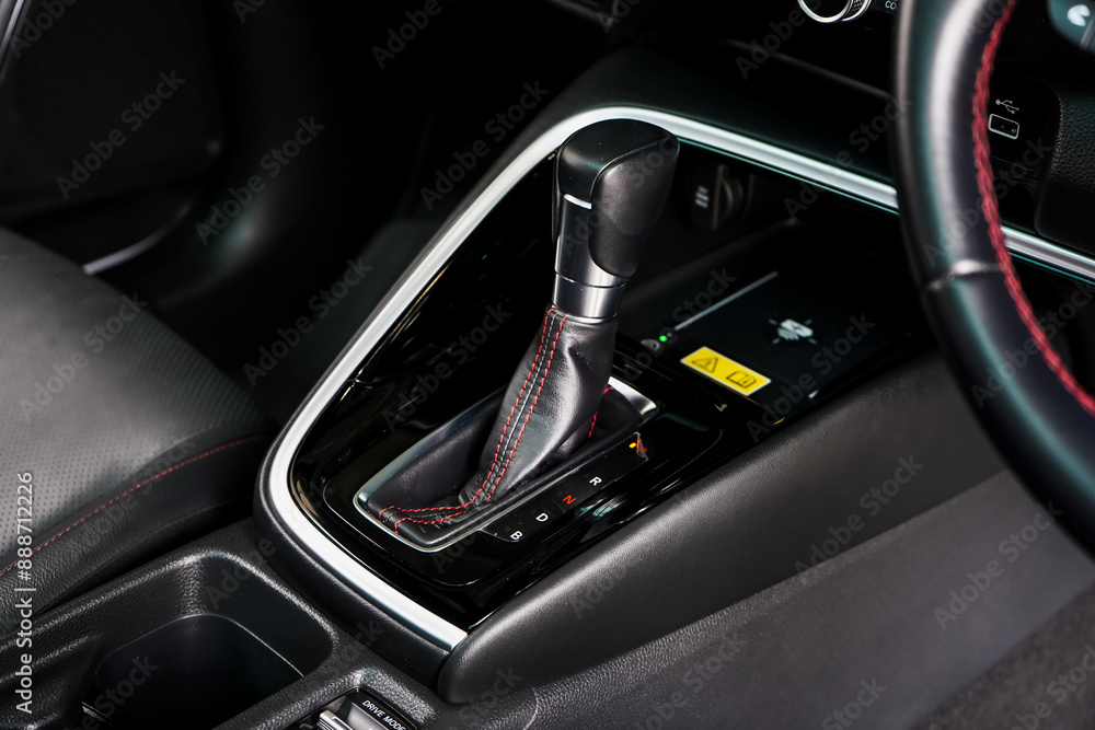 automatic transmission shift selector in the car interior. Closeup a manual shift of modern car gear shifter. 4x4 gear shift automatic transmission shift selector in the car interior. Closeup a manual shift of modern car gear shifter. 4x4 gear shift