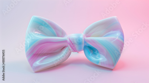 A bow pastel candy on light pink background.