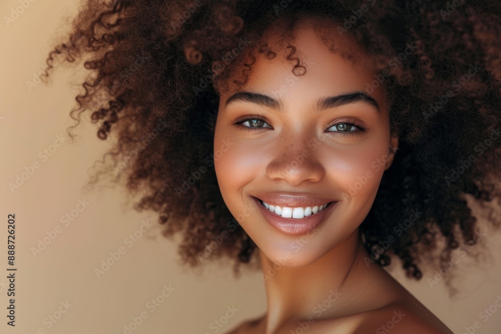 Portrait of a smiling beautiful afro girl with clean healthy skin on beige background Portrait of a smiling beautiful afro girl with clean healthy skin on beige background