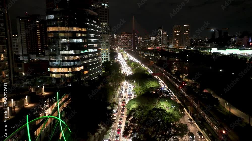 Street Traffic At Night City Sao Paulo Brazil. Bustling Downtown Cityscape With Modern Buildings. Building Illuminated Urban. Town Panorama. City Landmark. Night City Sao Paulo. Street Traffic At Night City Sao Paulo Brazil. Bustling Downtown Cityscape With Modern Buildings. Building Illuminated Urban. Town Panorama. City Landmark. Night City Sao Paulo.