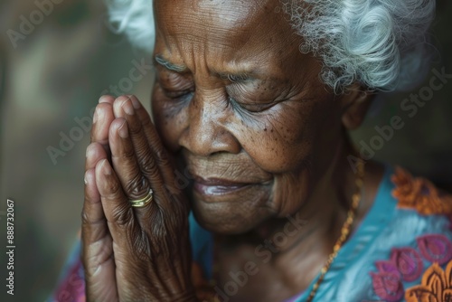 Old black woman praying God.  © Bargais