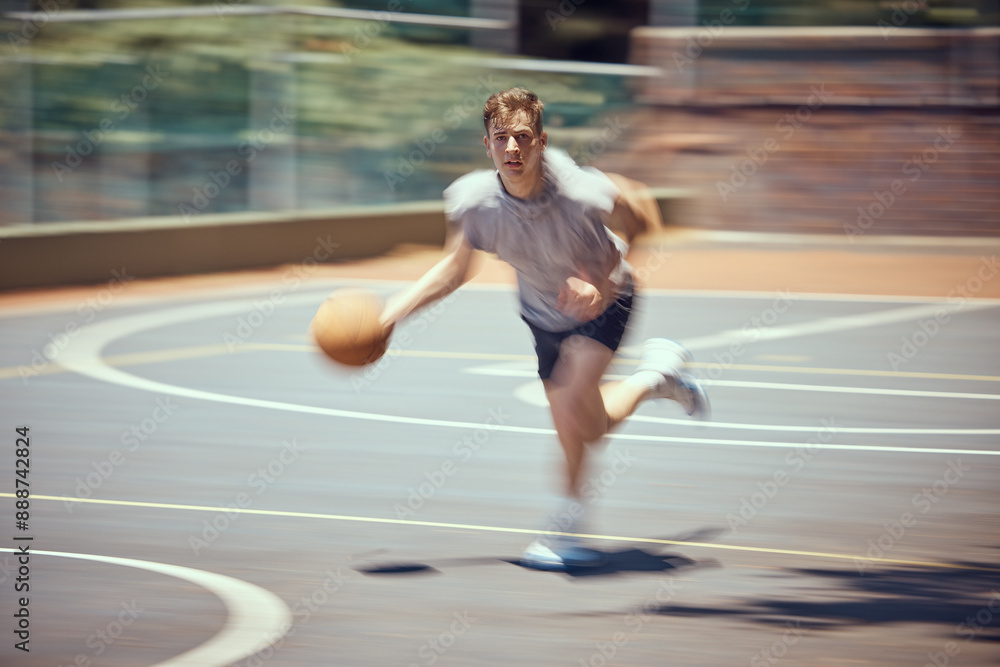 Basketball player, sports and training with a active, fit and fast man playing a game at an outdoor court. Professional athlete doing exercise for health and wellness during practice for a match Basketball player, sports and training with a active, fit and fast man playing a game at an outdoor court. Professional athlete doing exercise for health and wellness during practice for a match