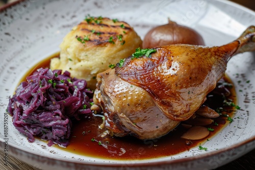 Roasted goose leg with red cabbage and dumplings