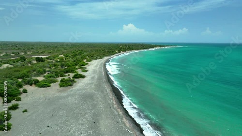 Wallpaper Mural Aerial drone view over empty sandy beach with bushes and sea shore with turquoise emerald ocean water in Dominican Republic Torontodigital.ca