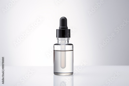 a clear bottle with a dropper