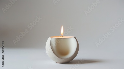 Minimalistic Ball-Shaped Candle in Ceramic Holder: A Study in Contemporary Home Decor