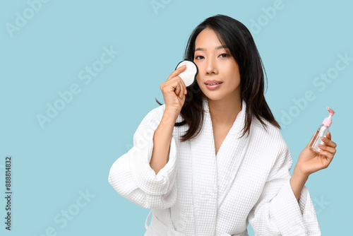 Young Asian woman with reus...