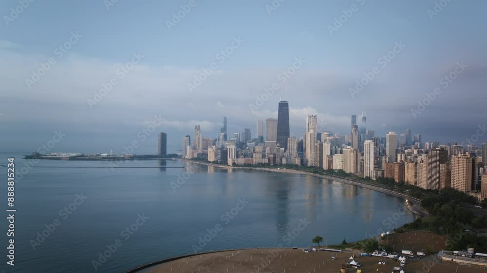Fast aerial timelapse flying towards downtown Chicago in the morning over North Avenue Beach and Lake Michigan. Fast aerial timelapse flying towards downtown Chicago in the morning over North Avenue Beach and Lake Michigan.