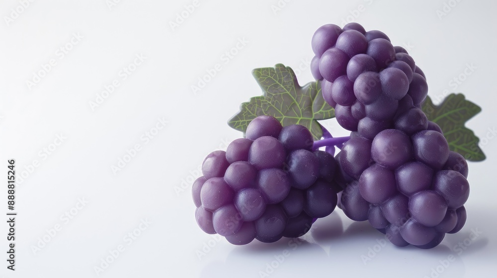 Rubber toy grapes for children on a white background enhancing child development through play Text space available Rubber toy grapes for children on a white background enhancing child development through play Text space available